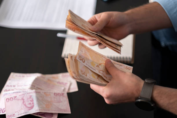 istock Person counting Turkish banknotes 1363491190