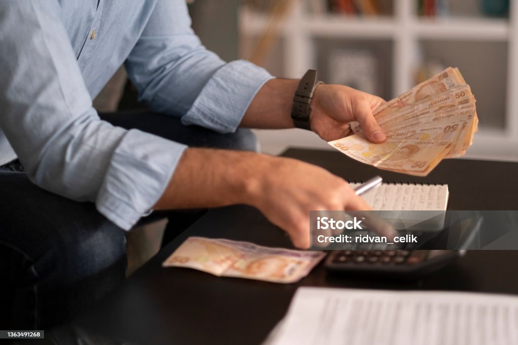 Person counting Turkish banknotes Currency Stock Photo