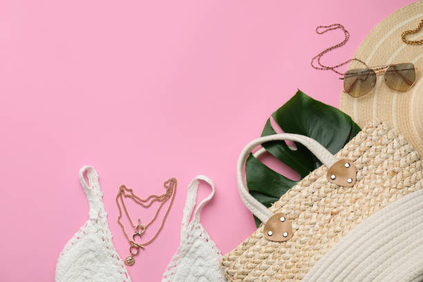 istock Flat lay composition with woman's straw bag on pink background. Space for text 1363491273