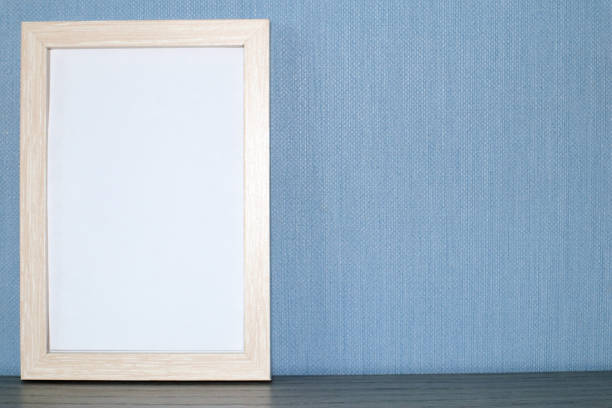 istock Mockup frame or poster on a blue wall background. 1363491306