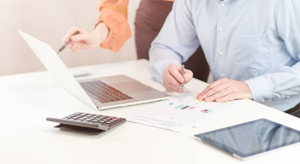 istock Business people discuss the business process on a laptop. 1363491732