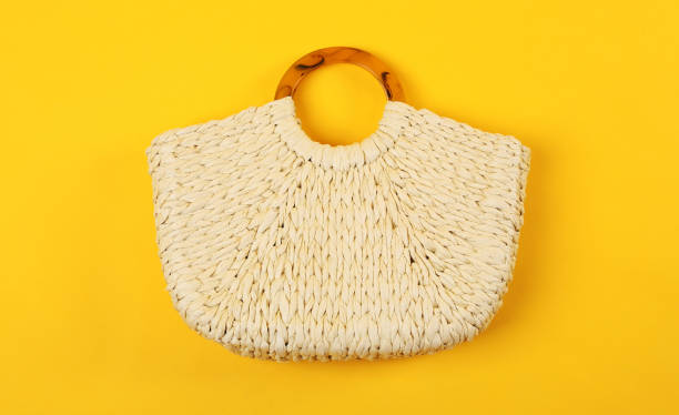 istock Stylish woman's straw bag on yellow background, top view 1363491737