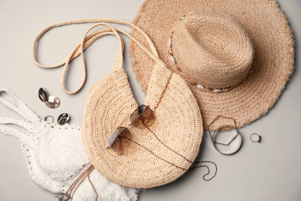 istock Stylish straw bag and summer accessories on grey background, flat lay 1363492322