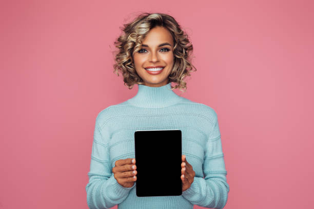 istock Beautiful girl with tablet computer 1363492873
