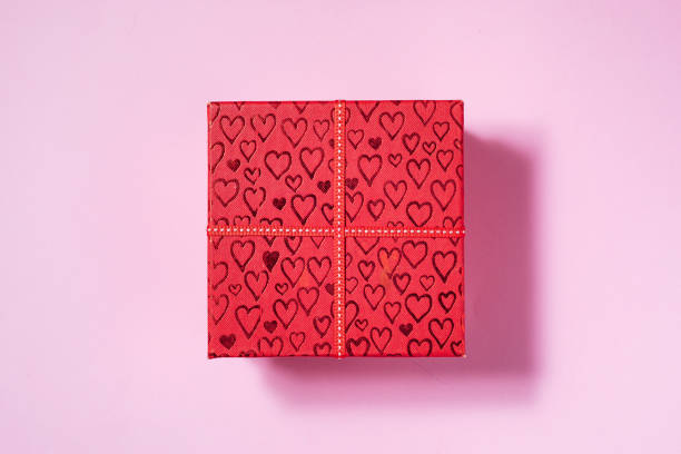 istock Valentine's Day Concept Red Gift Box with Hearts on Pink Background 1363493189