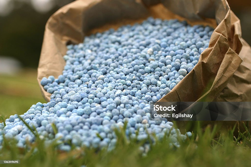 Bagged Fertilizer Blue fertilizer in brown paper bag Fertilizer Stock Photo
