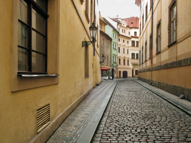 istock An empty cobblestone old street in Prague 1363497110