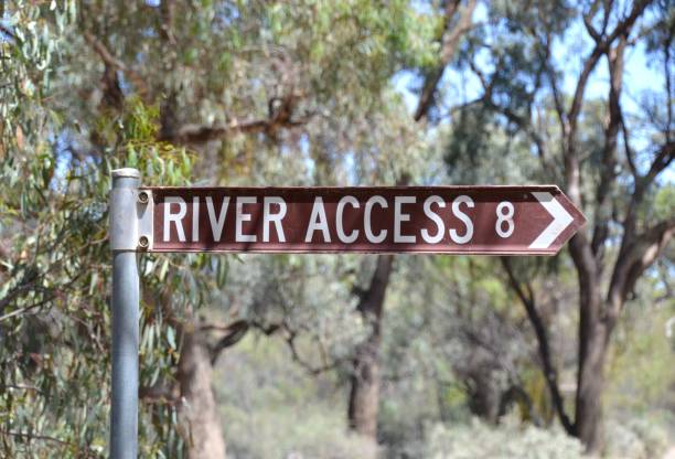 Information signpost or road sign shows an arrow pointing to a river access point on the Murray River near Mildura stock photo