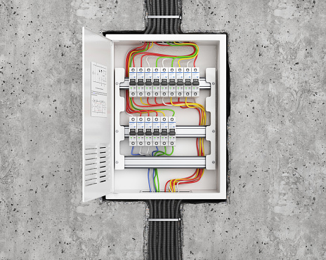 Voltage switchboard with circuit breakers in the concrete wall. Electrical background. 3d illustration