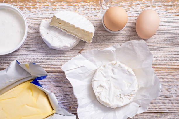 istock Yoghurt and cheeses on a wooden table. 1363504429