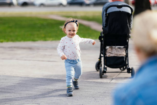 istock Adorable Girl Playing Outside With Her Anonymous Mom 1363504963