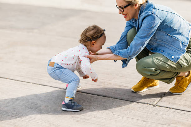 istock Single Mother Playing With Daughter in the Park 1363504983