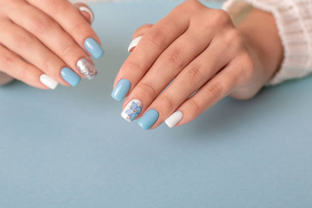 istock Female hands with romantic manicure nails 1363505094