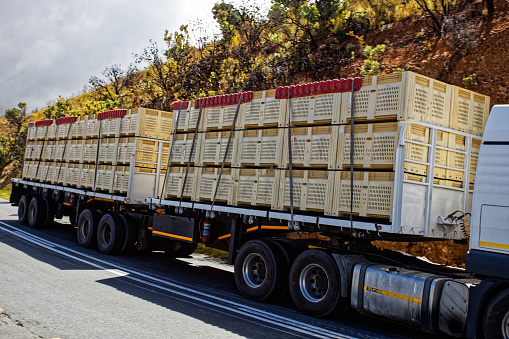 Fruit-laden truck and trailer descending mountain pass in Cederberg, Western Cape, South Africa