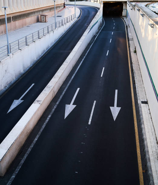istock adjoining streets in city entering tunnel 1363511383