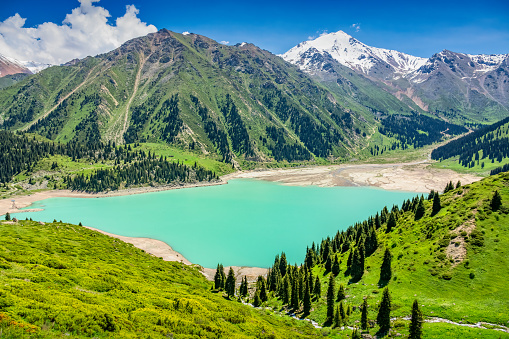 The beautiful Big Almaty Lake in the Ile Alatau Mountains near Almaty, Kazakhstan.