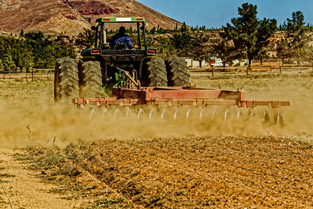 Powerful six-wheel tractor plowing field