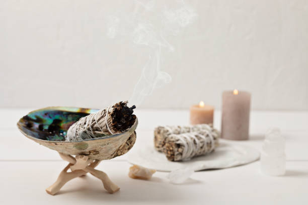 Smudge kit with white sage stick, abalone sea shell. Natural elements for cleansing negative energy Smudge kit with white sage stick, abalone sea shell. Natural elements for cleansing environment from negative energy, adding positive vibes. Spriritual practices, witchcraft concept incense photos stock pictures, royalty-free photos & images
