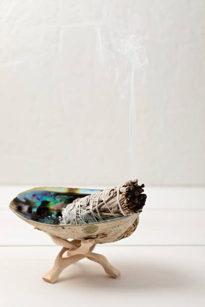 istock Smudge kit with white sage stick, abalone sea shell. Natural elements for cleansing negative energy 1363520058