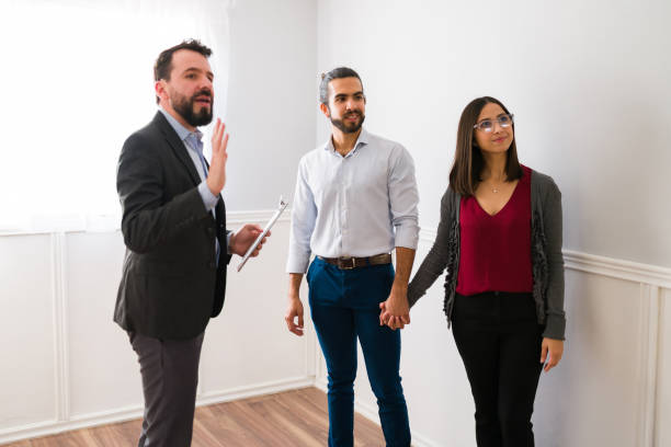 istock Real estate agent showing a house 1363521533