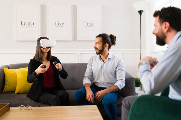 istock Beautiful couple using VR glasses for a house tour 1363521589