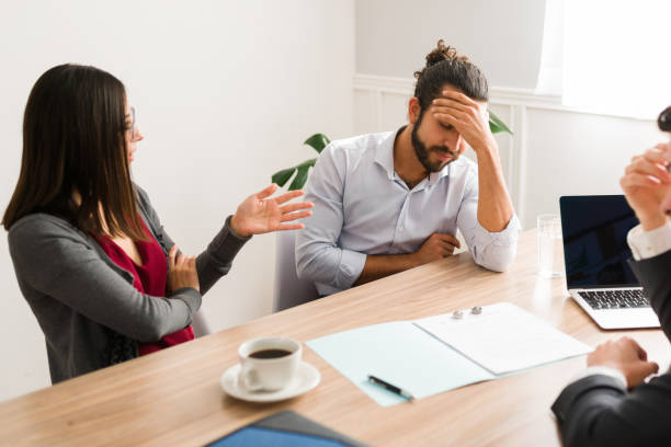 istock Angry couple with a divorce lawyer 1363522329