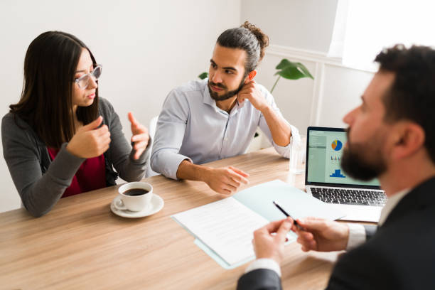 istock Clients talking about a mortgage debt 1363522555