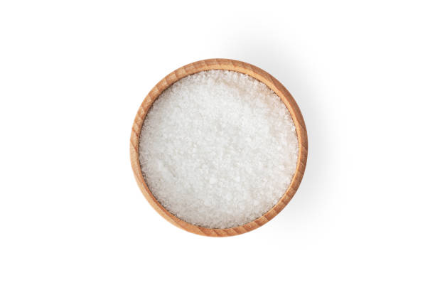 istock Salt in wooden bowl isolated on white background. 1363529924