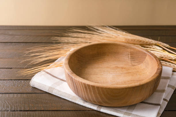 istock Empty plate on napkin on wooden table over grunge blue background. 1363530496