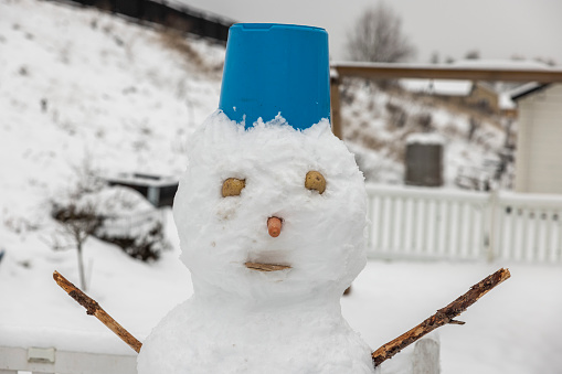 Close up of a funny snowman. Beautiful winter backgrounds. Sweden.