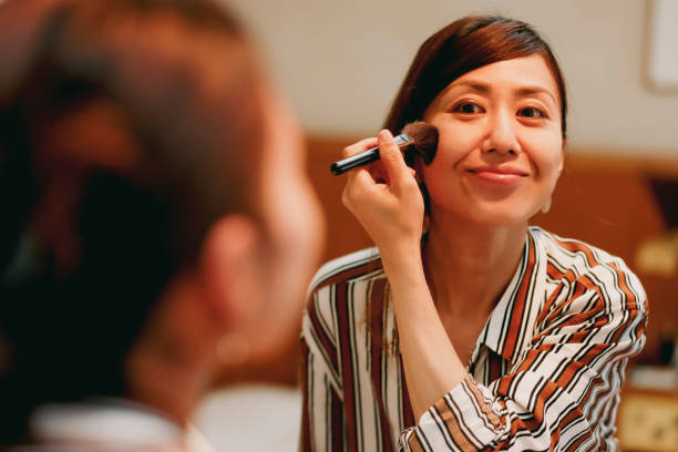 istock Asian woman looking mirror and make up 1363543385