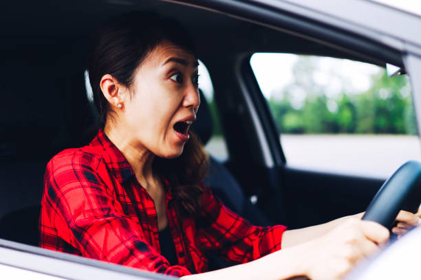 istock asian female driver and trouble 1363543638