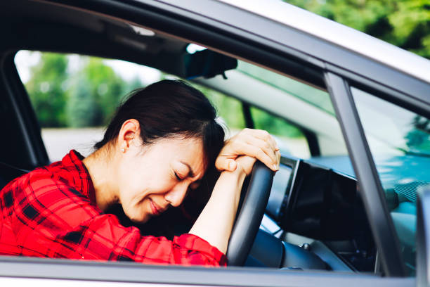 istock asian female driver and trouble 1363543650