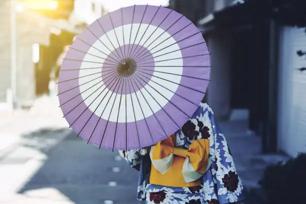 Photo of woman in a kimono walking in the Higashi Chaya district of Kanazawa, Japan