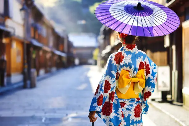 Photo of woman in a kimono walking in the Higashi Chaya district of Kanazawa, Japan