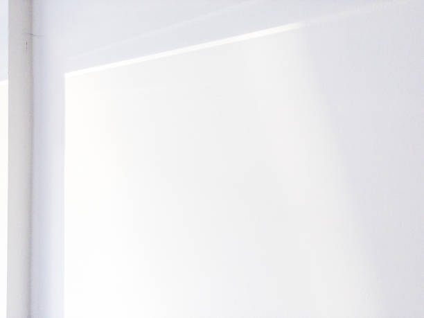 Shadows on wall. Abstract light, black shadow overlay from window on white texture wall. Sunlight architecture background. For product presentation, backdrop and mockup, summer seasonal concept.