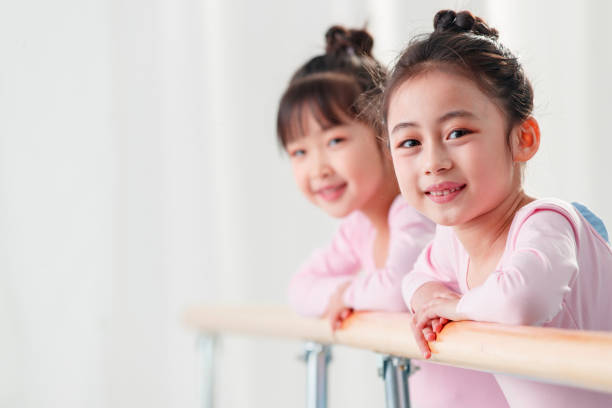 istock The little girl dancing over the railing 1363551348
