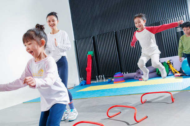 istock Children's physical training under the guidance of the coach 1363551375