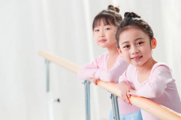 istock The little girl dancing over the railing 1363551394