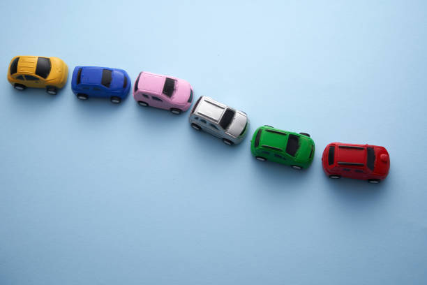 colorful toy car in arow -traffic jam - speelgoedauto stockfoto's en -beelden