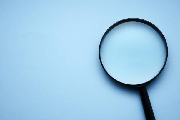 istock magnifying glass against blue background 1363554266