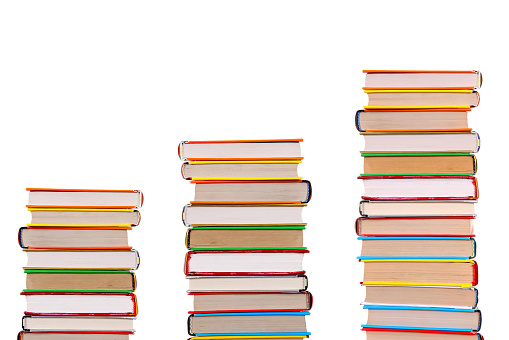 Three Pile of the Books Isolated on the White Background