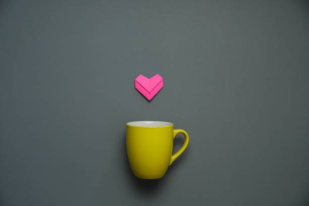 istock pink heart paper art on a coffee cup. 1363558185