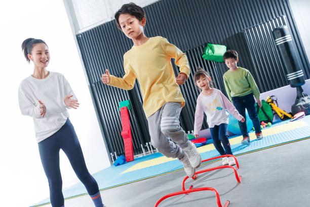 istock Children's physical training under the guidance of the coach 1363560228