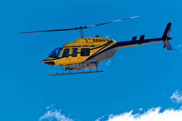 istock Side view of yellow crop spraying helicopter 1363562638