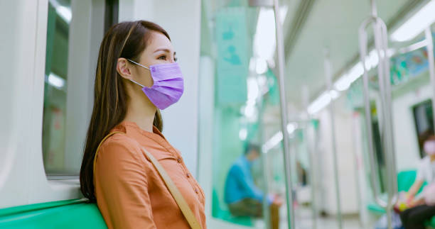 istock woman with mask in mrt 1363562965