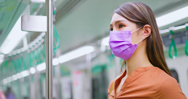 istock woman with mask in metro 1363562986