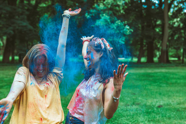 two women girlfriends having fun at holi fest. portrait