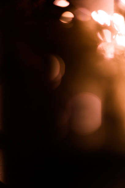 istock orange garland with flashlights, abstract light background 1363566594