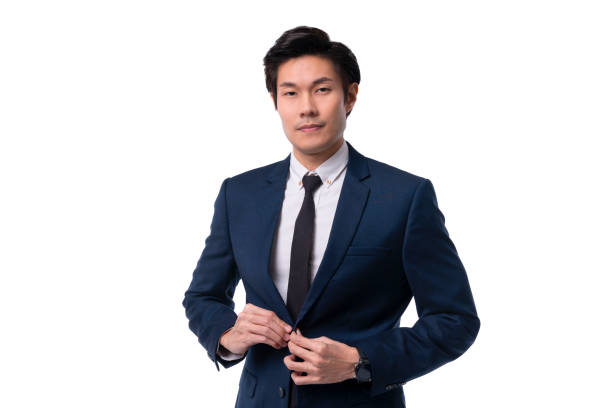 asian business man confident elegant handsome smart asian young man standing in front of a white background in a studio wearing a nice suit business leadership ideas concept stock photo